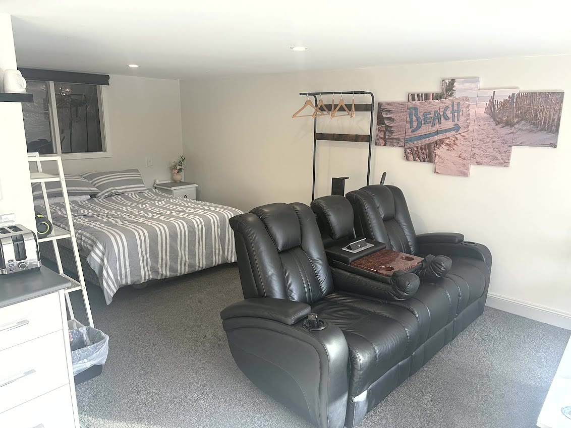 Living area and queen bed